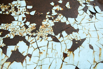 Fototapeta premium The vintage industrial background features a rusty, textured metal sheet with a blend of brown and blue tones, showcasing a rough, grunge pattern on its strong, antique alloy surface.