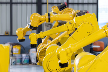 Industrial robotic arms arranged in a modern manufacturing facility