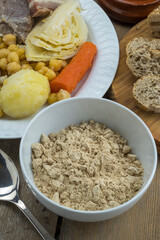Bol con gofio y plato de puchero canario