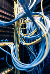 Network LAN internet cables connected in network switches. Server in data center, web hosting, dinamic scene, with white tones