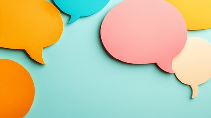 Multiple colorful speech bubbles symbolize communication, questions, and answers, conveying a concept of dialogue and exchange of ideas on a light blue background