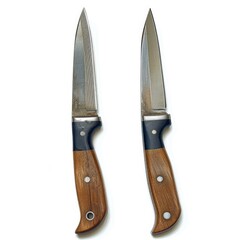 Two identical handcrafted knives with wooden handles and steel blades, isolated on a white background.