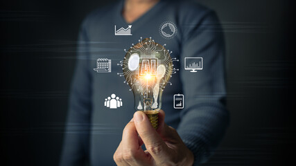 A man holds a glowing lightbulb embedded with AI circuits, surrounded by icons representing...