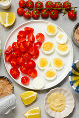 Festive Tuna Wreath Salad with tuna, eggs, cherry tomatoes and olives