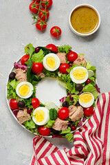Festive Tuna Wreath Salad with tuna, eggs, cherry tomatoes and olives