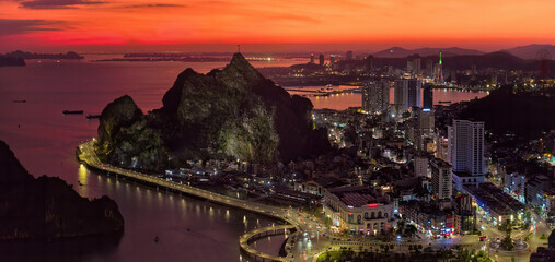 Sunset Over Ha Long Bay City, Vietnam – Illuminated Skyline and Coastal Promenade, Ideal for...