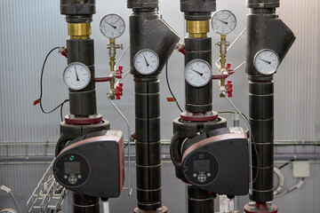 Industrial Heating System with Pressure Gauges, electronically controled Pumps and Control Valves in a Modern Heating Plant – Precision Engineering for Energy Management and distribution.