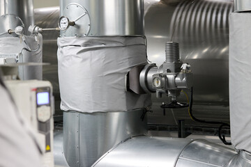 Modern Heating Plant Interior with Steel Pipelines and Advanced Control Systems – Efficient Energy Infrastructure in Industrial Environment.