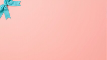 Vibrant coral pink backdrop with turquoise ribbon and bow for summer celebrations