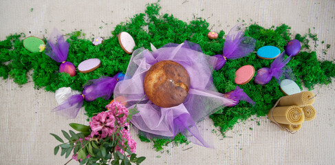 Happy Easter Easter festive spring table setting decoration, eggs, Easter cake, willow branches in vase. Easter family dinner or breakfast concept