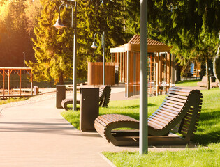 modern wooden city park on the river bank surrounded by forest