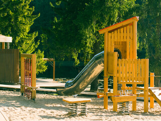 modern wooden playground on the lake shore