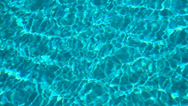 Clear clean water in a pool with a tiled bottom