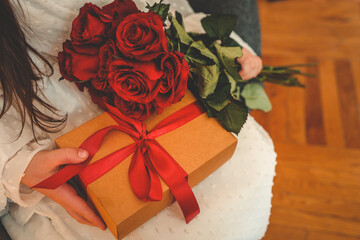 Brown craft paper gift box with a vibrant red satin ribbon and bow. Perfect for Valentine's Day, anniversaries, or romantic occasions