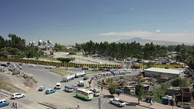 Busy traffic moving through a roundabout in Addis Ababa, Ethiopia.