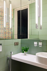 Explore Modern Bathroom Design with Green Tiles and Stylish Lighting for aesthetic appeal