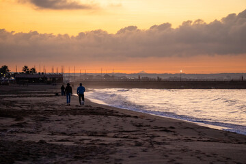 People walking in the sunset