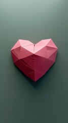 Geometric pink heart sculpture on a green background