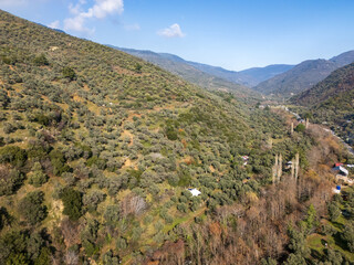 Lush green valley surrounded by rolling hills in the mediterranean countryside