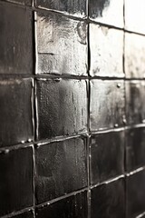 Polished metallic tiles create a reflective surface in a modern interior design setting with sleek aesthetics