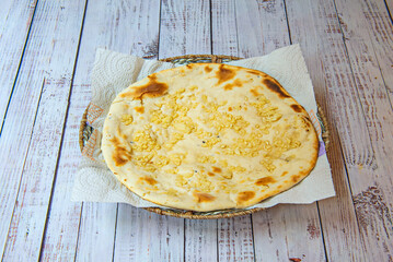  naan bread is usually made from wheat flour, yeast, yogurt, salt and sometimes clarified butter (ghee) is added to give it a richer flavor and soft texture