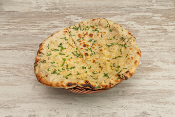 Naan bread is a type of flatbread originating from Central and South Asia, especially popular in the cuisine of India, Pakistan, Afghanistan and other countries in the region