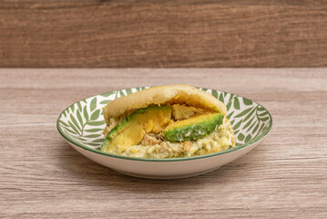 arepas can be filled with a wide variety of ingredients ranging from cheese, shredded beef, shredded chicken, ham, and scrambled eggs to more attractive ingredients such as shrimp, avocado