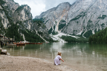  Little girl collecting rocks at Lake Braies