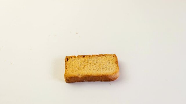 Close-up of a neatly stacked pile of golden-brown rusks. The texture appears crisp and the color is consistent throughout. Simple, delicious, and ready to eat.
