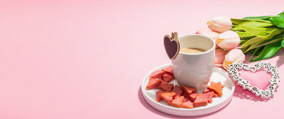 Valentine's Day romantic concept. Morning coffee, a bouquet of tulips, symbolic decor