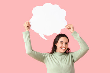 Young woman with blank speech bubble on pink background