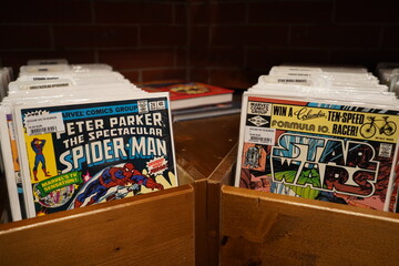 Naklejka premium paris, france ,01 01 2025 : collection of american comics in the bookstore, Spiderman , Star Wars