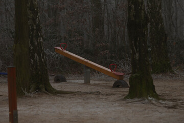 Winter playground scene, outdoor play. No people. Twilight dusk frozen time.