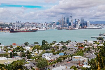 Panoramic view of Auckland, New Zealand. City skyline, harbor, and residential areas are visible. A...