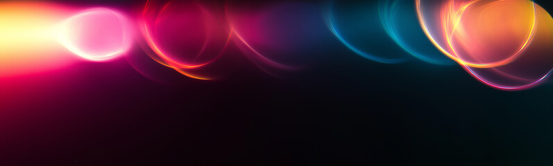 Fototapeta premium Abstract light trails creating vibrant circles on dark background