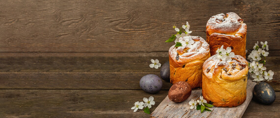 Easter cake Cruffin or sweet bread kulich with painted eggs. Traditional festive baking