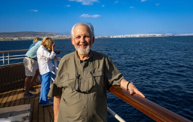 Man on small ship sailing to Mykonos