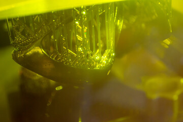 Process working 3D printer close-up. 3D printing from liquid material close-up.