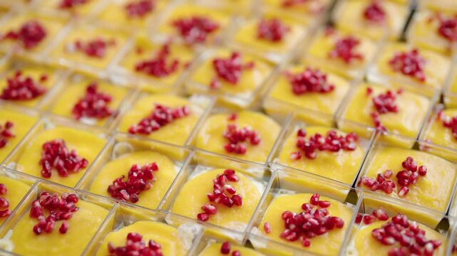 catering desserts with mango mousse and pomegranate seeds
