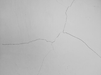 Abstract texture of smooth crack on the white wall