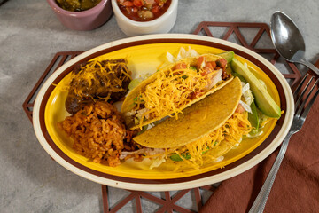 Taco plate with spanish rice and beans