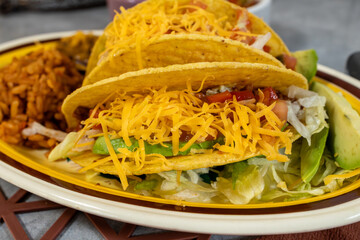 Taco plate with spanish rice and beans