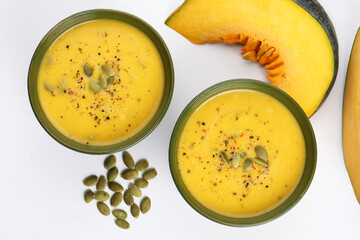 Pumpkin soup. Vegetarian soup with pumpkin seeds in ceramic bowl