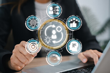 Business professional interacting with digital icons representing competence concepts, skill...