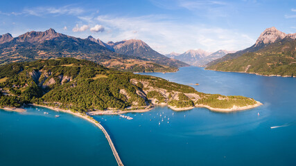 Aerial view of Serre-Poncon Lake with Chanteloube Bay and submerged viaduct. Summer in Durance...