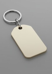 Fototapeta premium Minimalist blank keychain on grey surface with silver ring