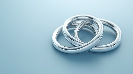 Fototapeta premium Clean 3D render of interlocking rings on a simple blue background with light reflections