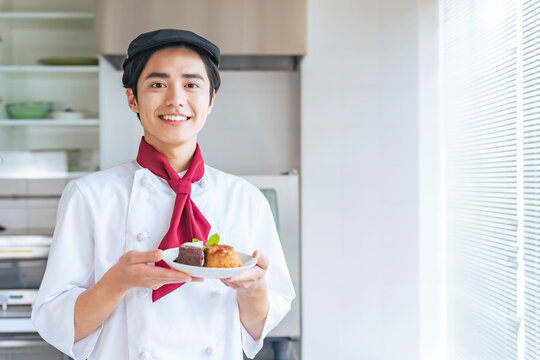 cake, man, chef, person, people, pastry chef, pastry, cook, oven, kitchen, dessert, suit, patisserie, pastry shop, store, vocational school, prototype, smile, cooking, confectionery, bakery, bake, bak