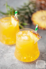 Fresh pineapple alcoholic cocktail with ice. Summer cocktail and bar concept.