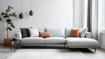 Obraz premium A large gray sectional sofa is the main focus of the image